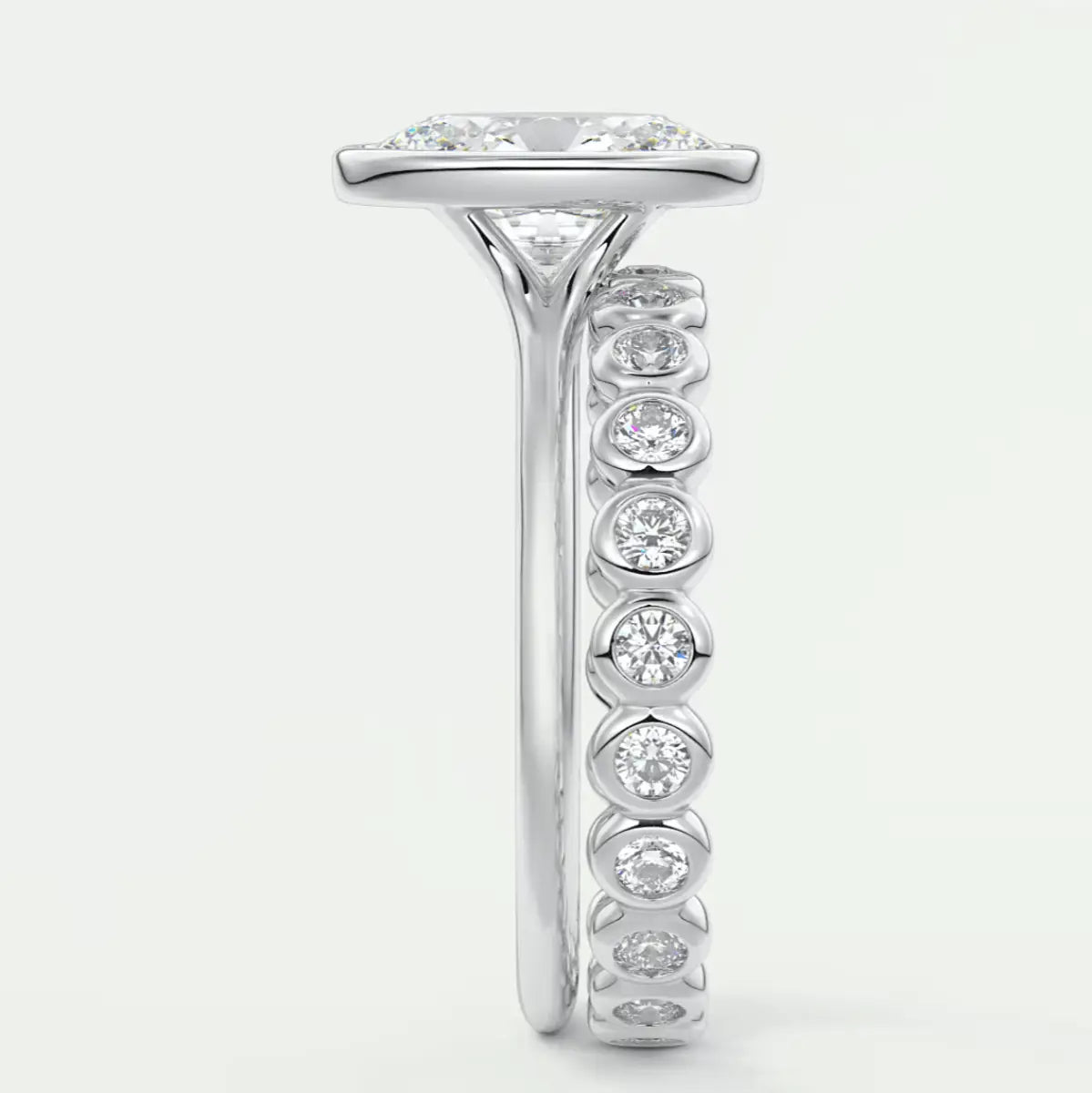18k white gold diamond engagement ring with a princess cut center stone and channel set diamonds on the band.