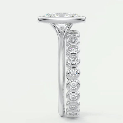 18k white gold diamond engagement ring with a princess cut center stone and channel set diamonds on the band.