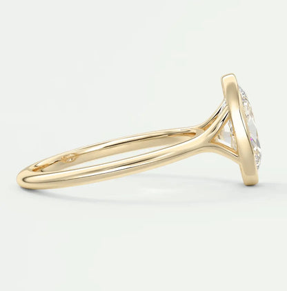 18k yellow gold diamond engagement ring with a round brilliant cut stone.
