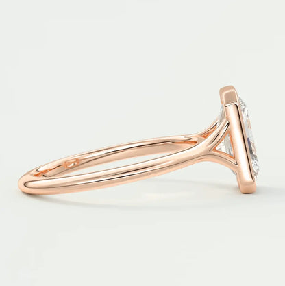 18k rose gold engagement ring with a round diamond.