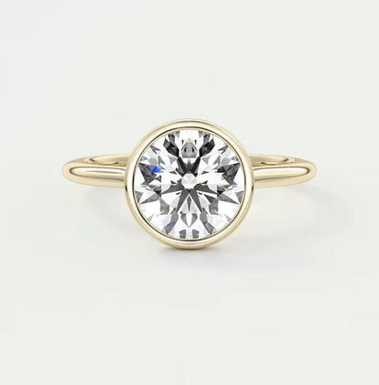 18-karat yellow gold solitaire diamond engagement ring.