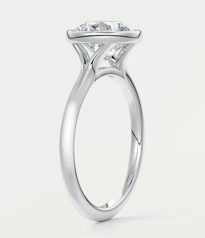 18-karat white gold solitaire engagement ring with a princess-cut diamond.