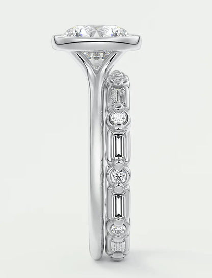 18-karat white gold diamond engagement ring with a central cushion-cut stone and baguette side stones.
