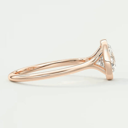 18-karat rose gold diamond engagement ring with a classic solitaire design.