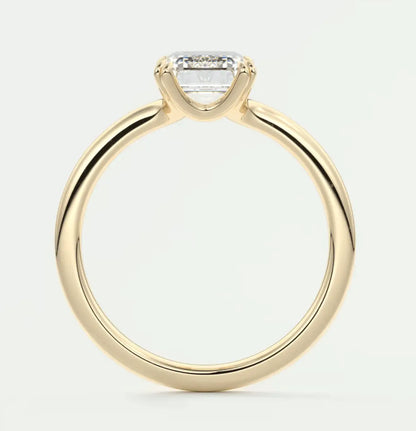18k yellow gold engagement ring with a princess cut diamond.