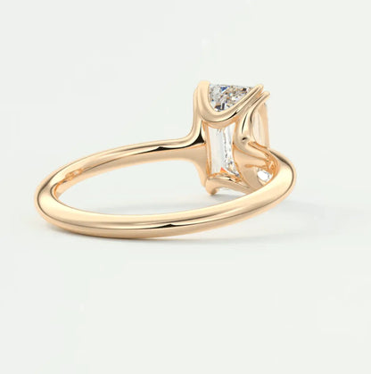 18k gold engagement ring with a princess cut diamond.