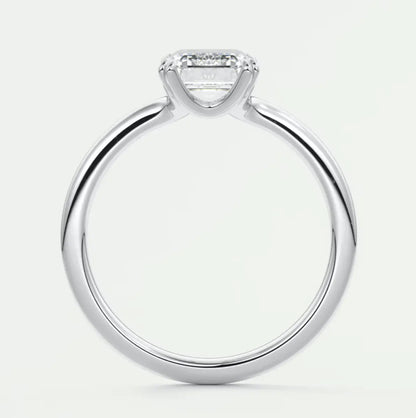 White gold engagement ring with a princess cut diamond and small diamonds on the band.