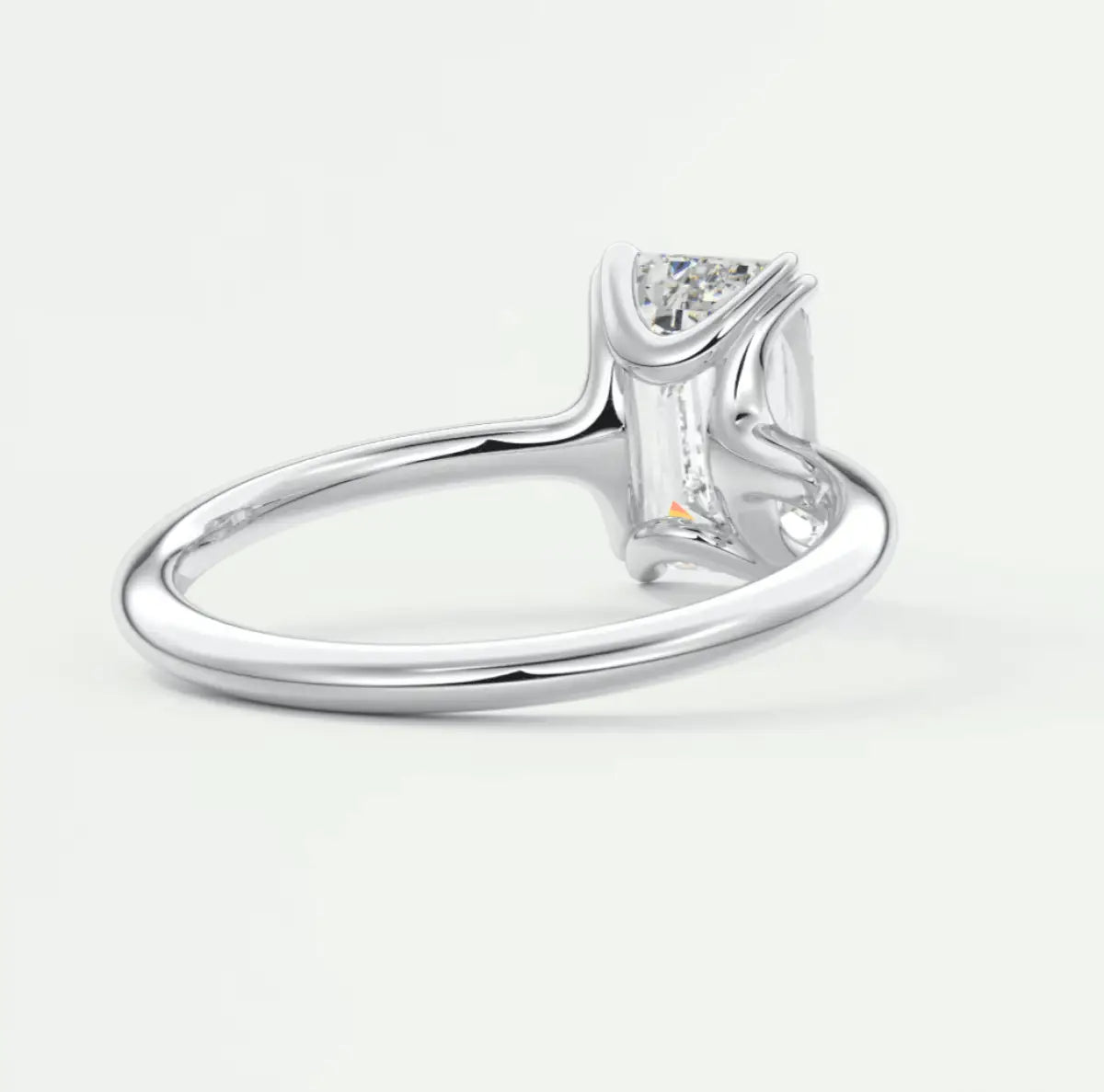 18k white gold solitaire engagement ring with a princess cut diamond.