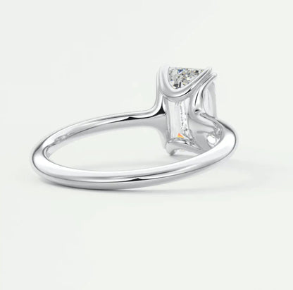 18k white gold solitaire engagement ring with a princess cut diamond.