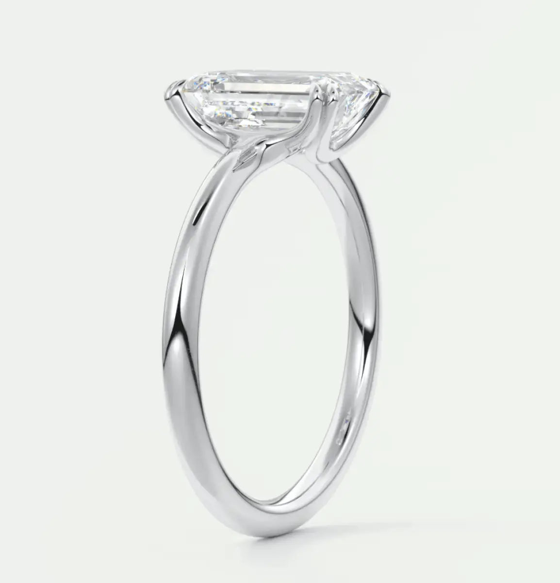 18k white gold emerald cut diamond engagement ring.