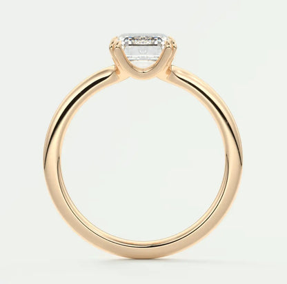 18k gold engagement ring with a princess cut diamond.