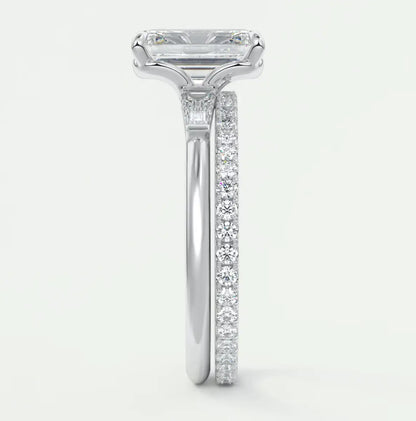 Custom made elysian emerald three-stone engagement ring with tapered baguettes
