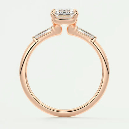Custom made elysian emerald three-stone engagement ring with tapered baguettes
