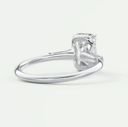 Custom made elysian emerald three-stone engagement ring with tapered baguettes