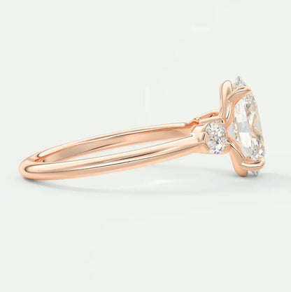 18k rose gold engagement ring with marquise-cut diamond and small round diamonds, featuring a delicate floral design.