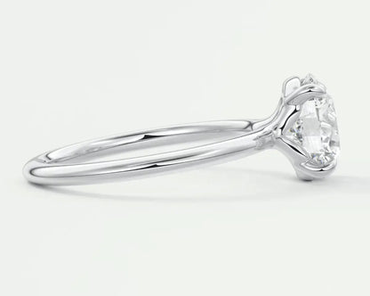 18-karat white gold solitaire diamond engagement ring.