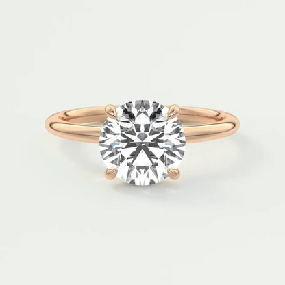 18k rose gold engagement ring with a cushion-cut diamond.