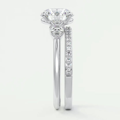 Custom made elysian round three-stone engagement ring with pear side stones | diamond lab