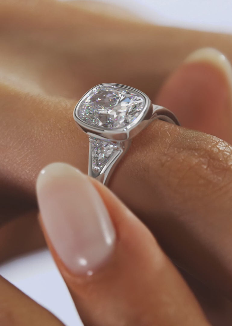 Véda Trilogy – Cushion with Trillion Side Stone Split Shank Engagement Ring
