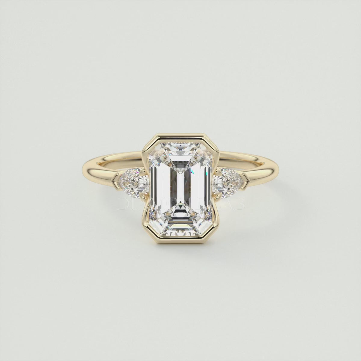 Solara Emerald Half Bezel Three-Stone Engagement Ring