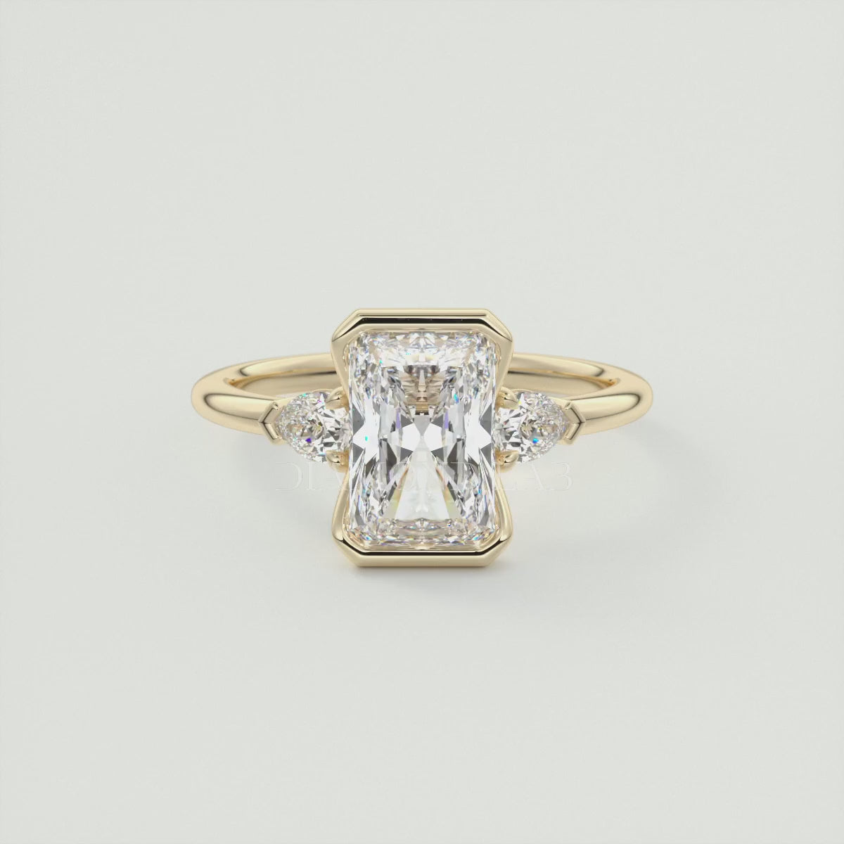 Solara Elongated Radiant Half Bezel Three-Stone Engagement Ring