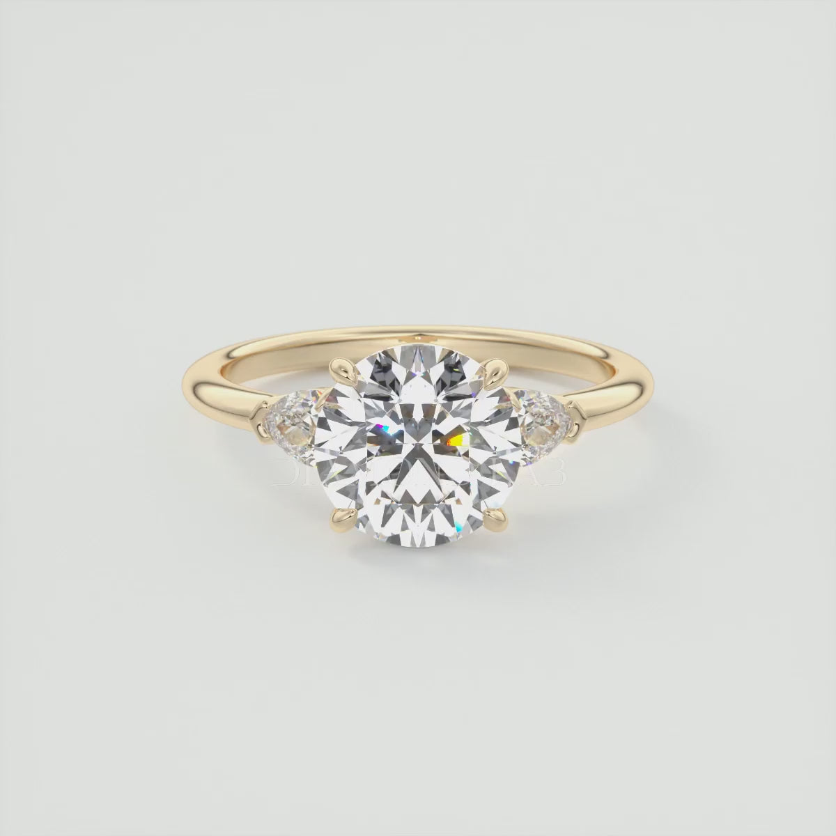Elysian Round Three-Stone Engagement Ring with Pear Side Stones