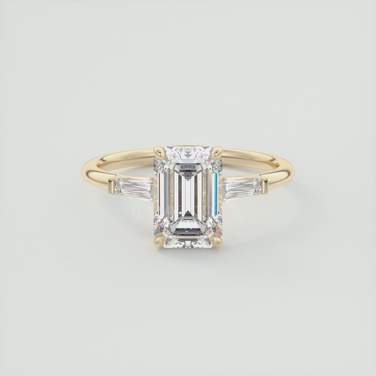 Elysian Emerald Three-Stone Engagement Ring with Tapered Baguettes