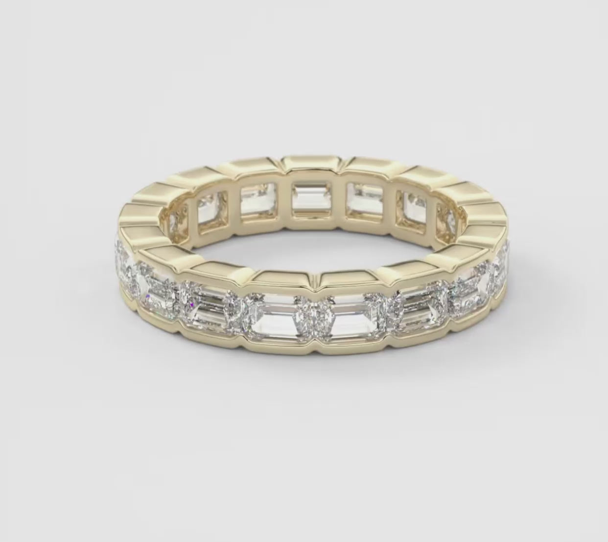 Solara East-West Emerald Half-Bezel Eternity Band