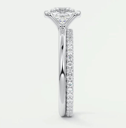 18k white gold princess cut diamond engagement ring with a matching band.