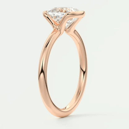 Rose gold engagement ring with a princess cut diamond.