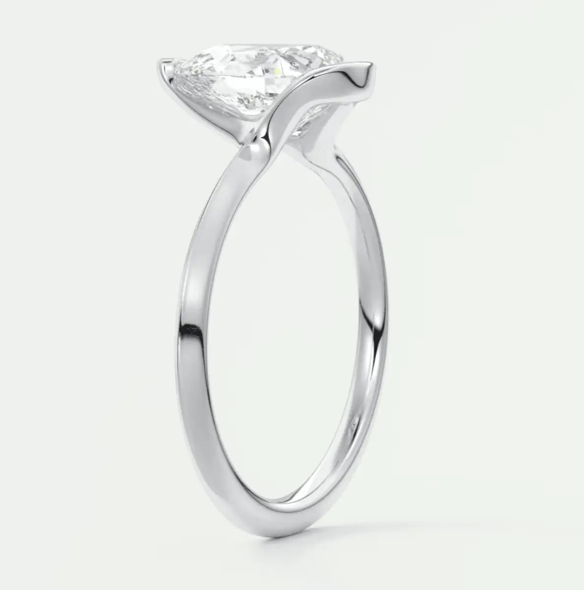 Princess cut diamond engagement ring with a white gold band.