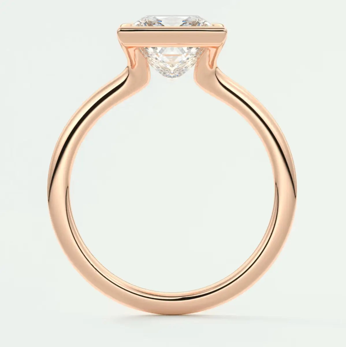 18k rose gold engagement ring with a round diamond.