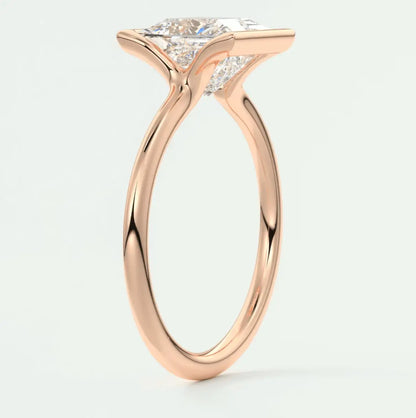 18-karat rose gold engagement ring with a princess-cut diamond.