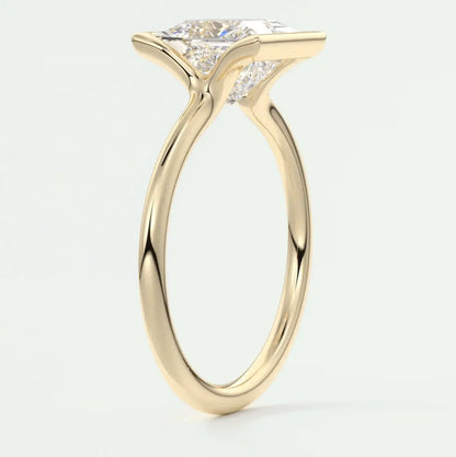 18k yellow gold engagement ring with a princess cut diamond.