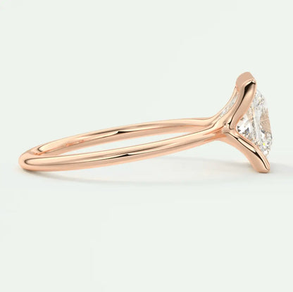 18-karat rose gold engagement ring with a marquise-cut diamond.