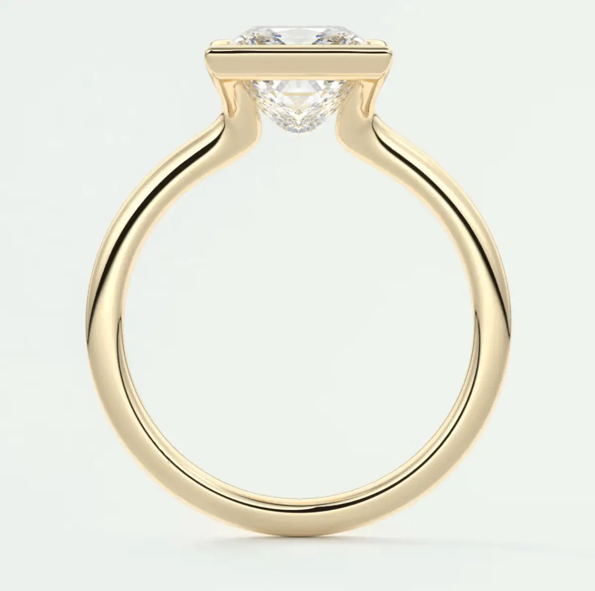 18k yellow gold engagement ring with a round diamond.
