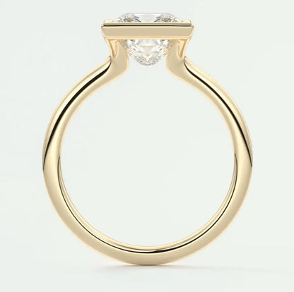 18k yellow gold engagement ring with a round diamond.