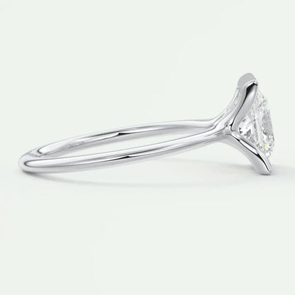 18-karat white gold engagement ring with a marquise-cut diamond.