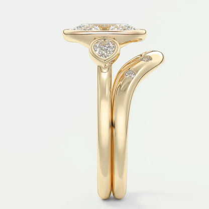 18-karat yellow gold engagement ring with a cushion-cut diamond center stone and small round diamonds on the band.